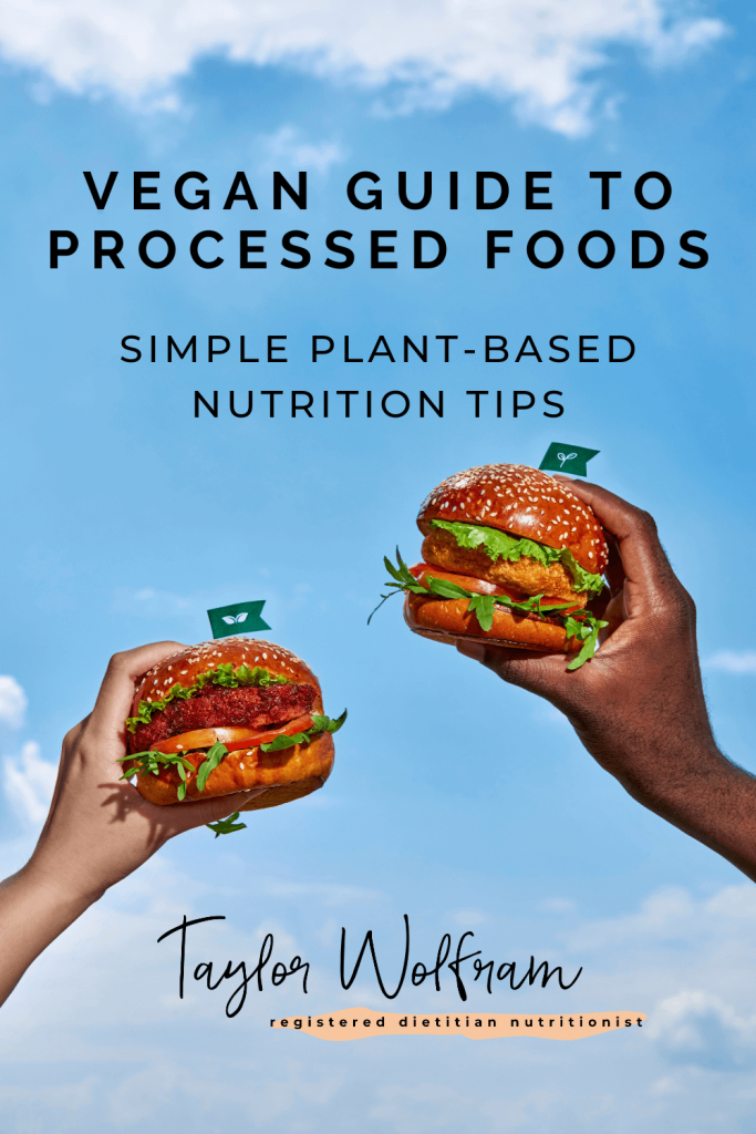 two hands holding up plant-based burgers on a background of blue sky with white clouds