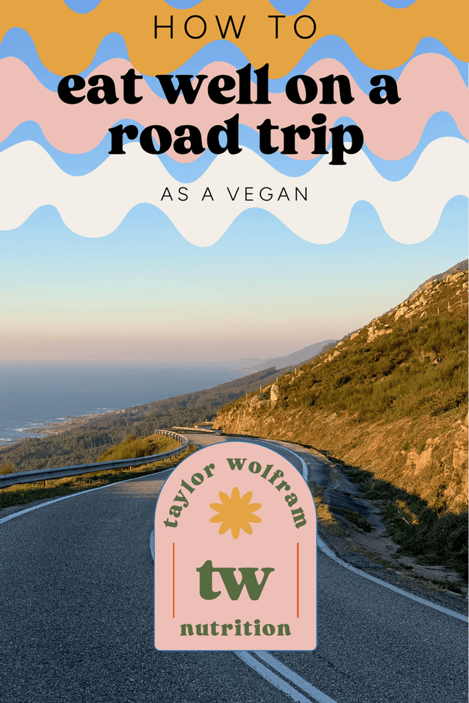 Text saying how to eat well on a road trip as a vegan over an image of a winding road with mountains on one side and ocean on the other. Taylor Wolfram Nutrition logo at the bottom center.